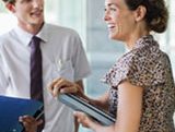 lady with bad hair talks to man with awkward tie about the long hiring process